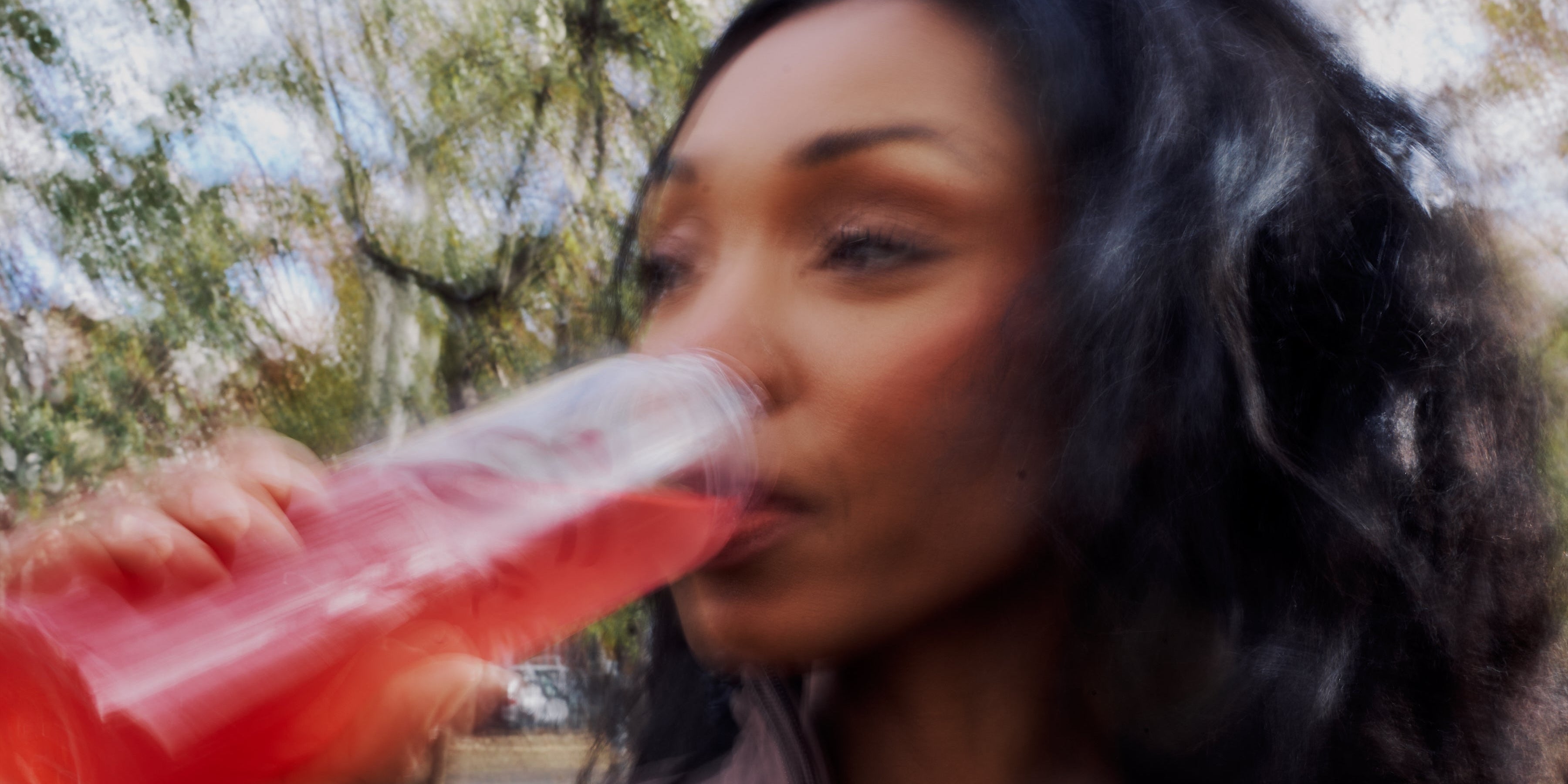 Midlife woman drinking ByEla
