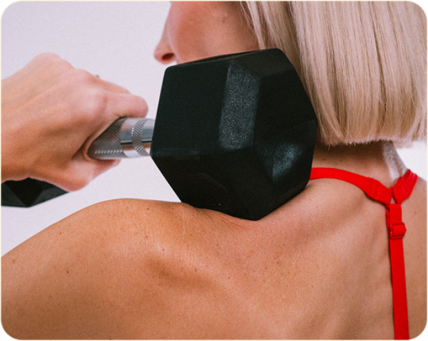 Close-up of women in activewear training with weights, representing a new era of women’s wellness and strength-focused aging.